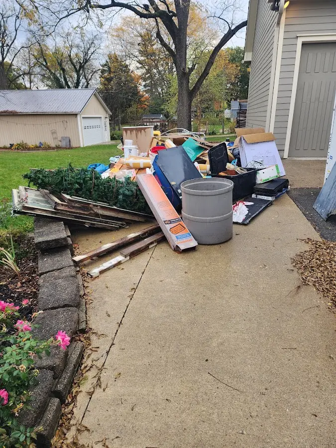 Dumpster being loaded with debris for 3 Yard Dumpster Rental in Larch Way